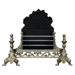 A Decorative Brass and Steel Firegrate