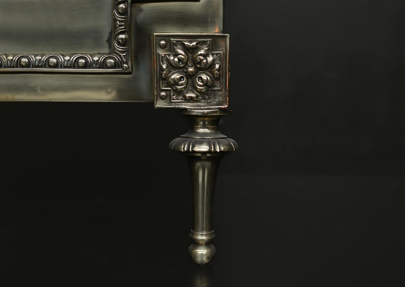 A large brass coal bucket with bowed lid. The gadrooned feet surmounted by square cast paterae and egg-and-dart beading. Decorative hinges to top. English, 19th century.

Height:	508 mm      	20