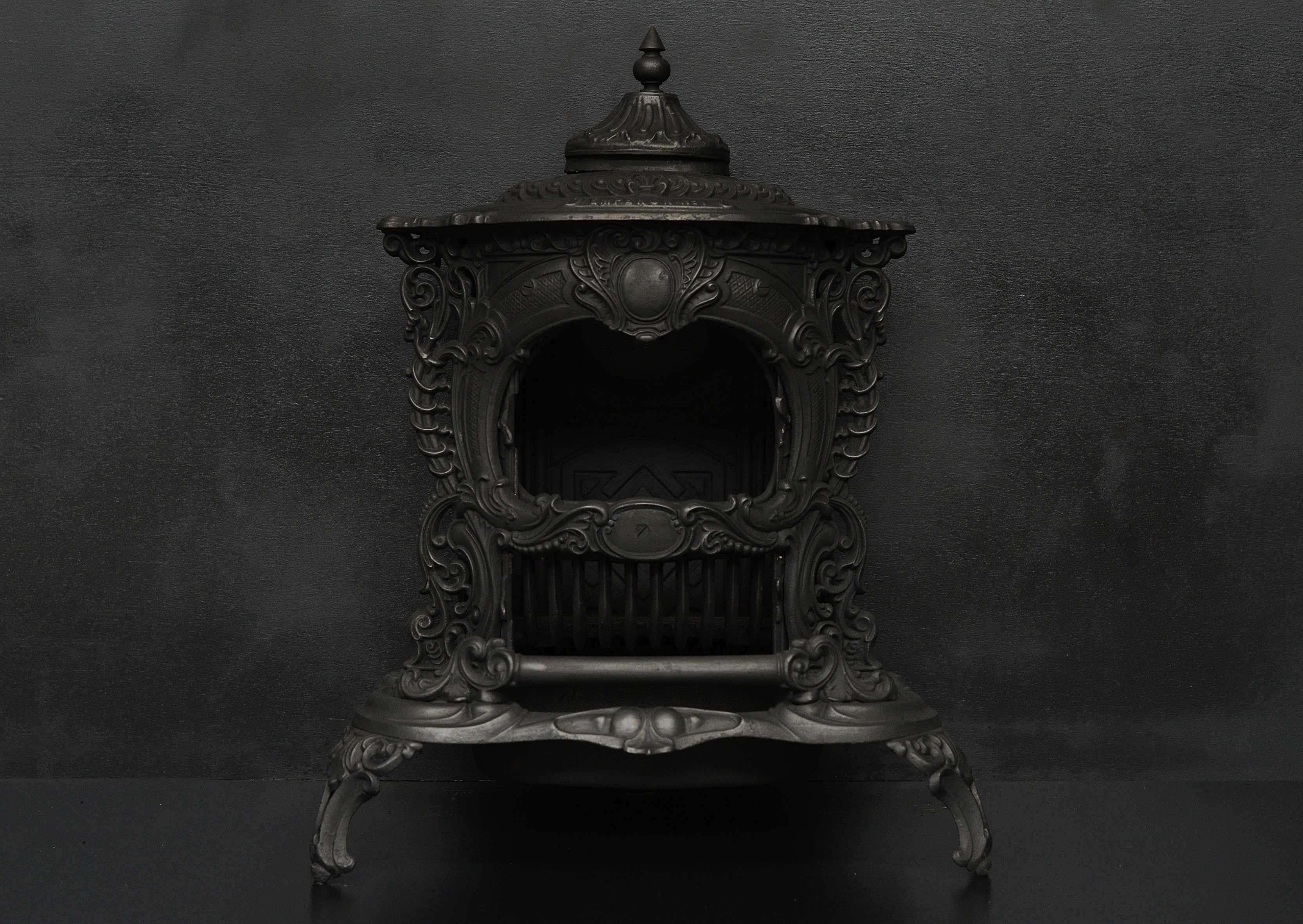 A decorative cast iron stove made by the Smith and Wellgood Ltd Stoveworks. The top with guilloche and scroll detailing, flutes and sunburst to doors. Emperor No. 1 model. 2nd half of 19th century. Could be polished if required.

Width At Front:	660