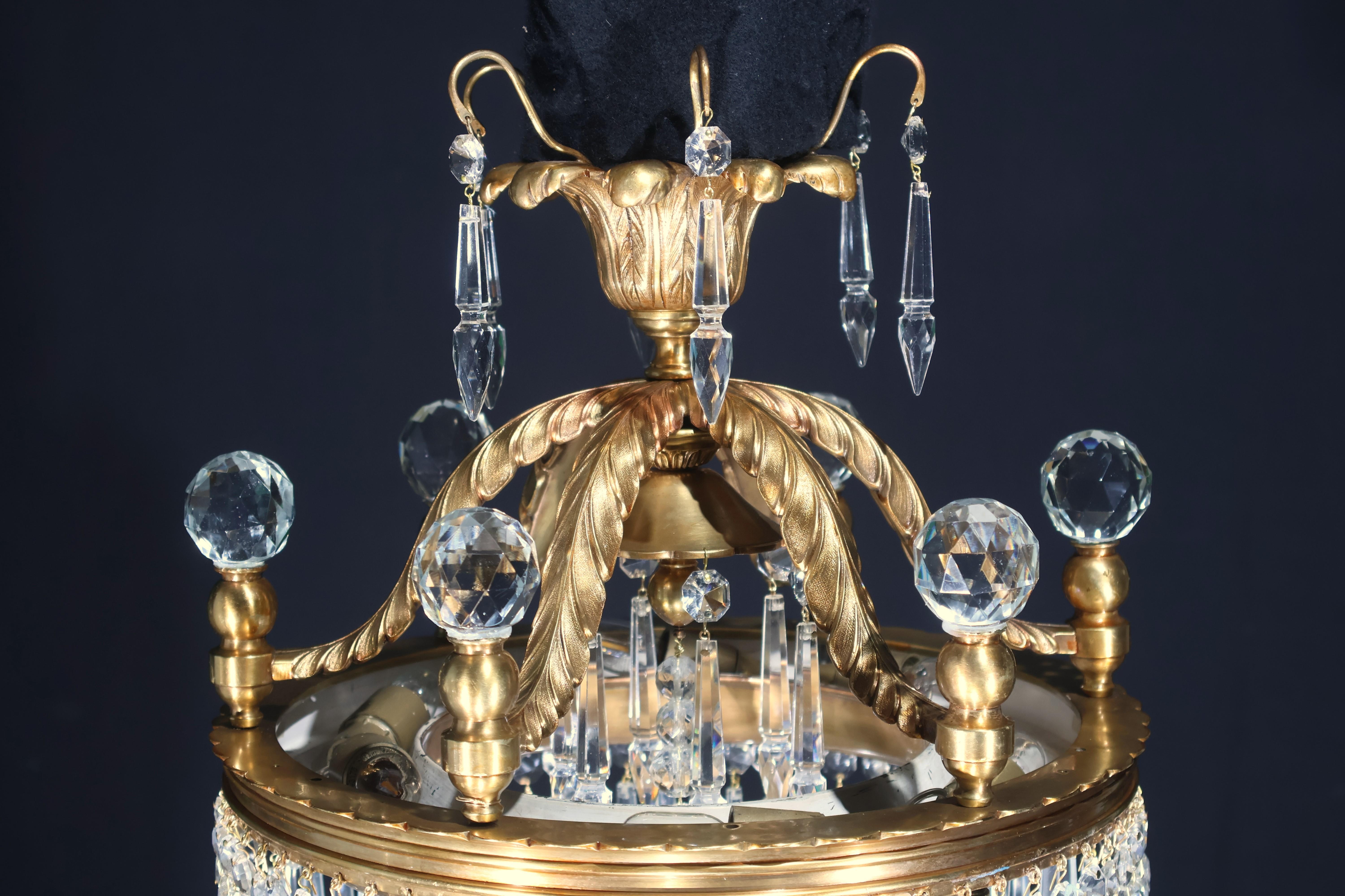 A Very Fine and Decorative Chandelier for Indirect Light in the Louis XVI style. The lights are fitted inside a round bronze gallery on top issuing supports for six faceted crystal balls, at the bottom faceted u drops.
France, circa 1900. 6 lights.