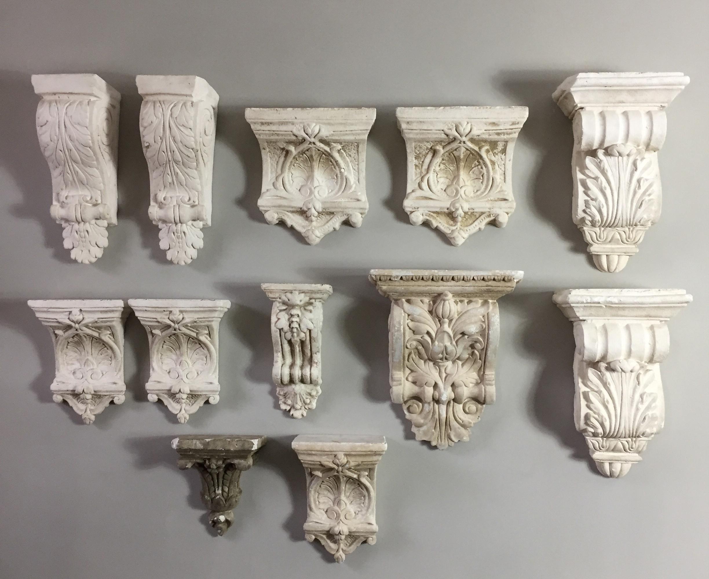 A decorative collection of 12 plaster corbels.

There are four pairs and four individual examples, with some light loss or age related chipping but nothing that detracts.

Varying sizes and shapes ranging in height from 22cm for the smallest up