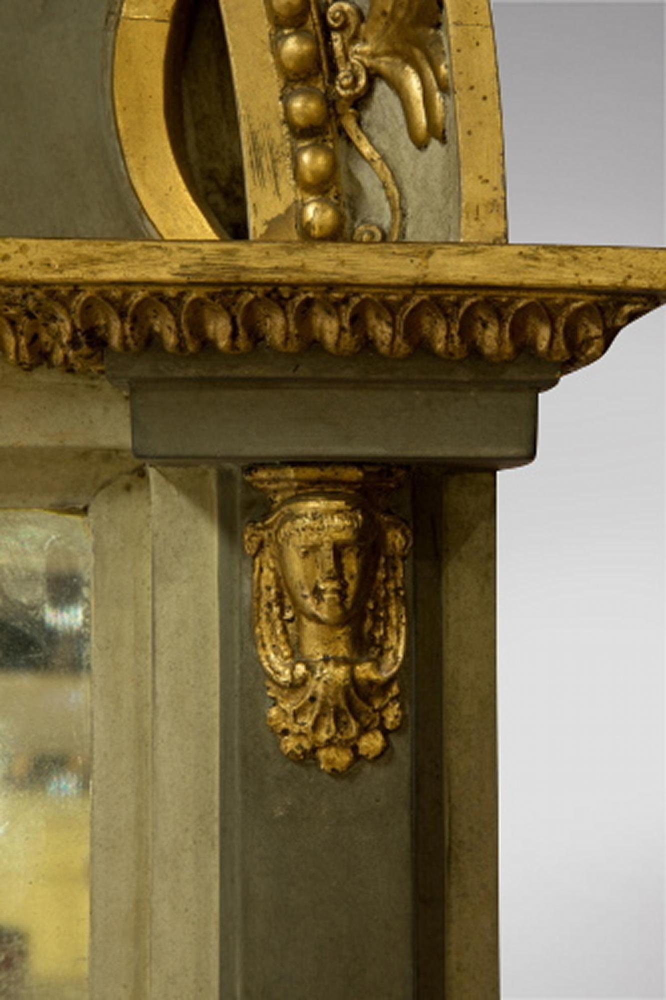 A Decorative Swedish Gustavian Pier Mirror 19thc, with embossed gilt face surrounded by gilt relief embellishment reminiscent of the Sun God Louis XIV. The mirror is consistent with age.