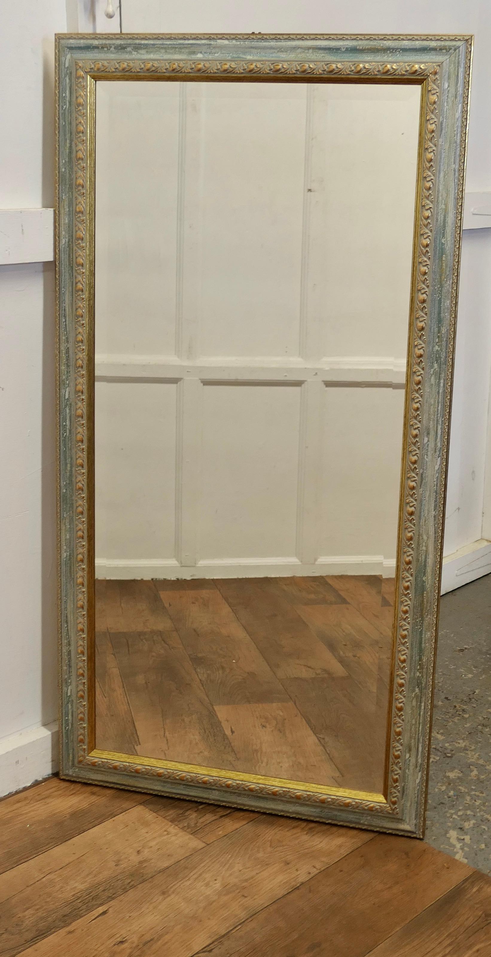 A Decorative Long Gilt and Pale Blue Dressing Mirror

A delightful piece, the mirror has a 4” wide pale Blue and Gilt decoratively moulded frame, the looking glass is in bevelled and in good condition
A very good decorative piece, the mirror can