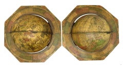 A decorative pair of rare table globes in a fine condition.