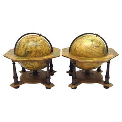 A decorative pair of rare table globes in a fine condition.