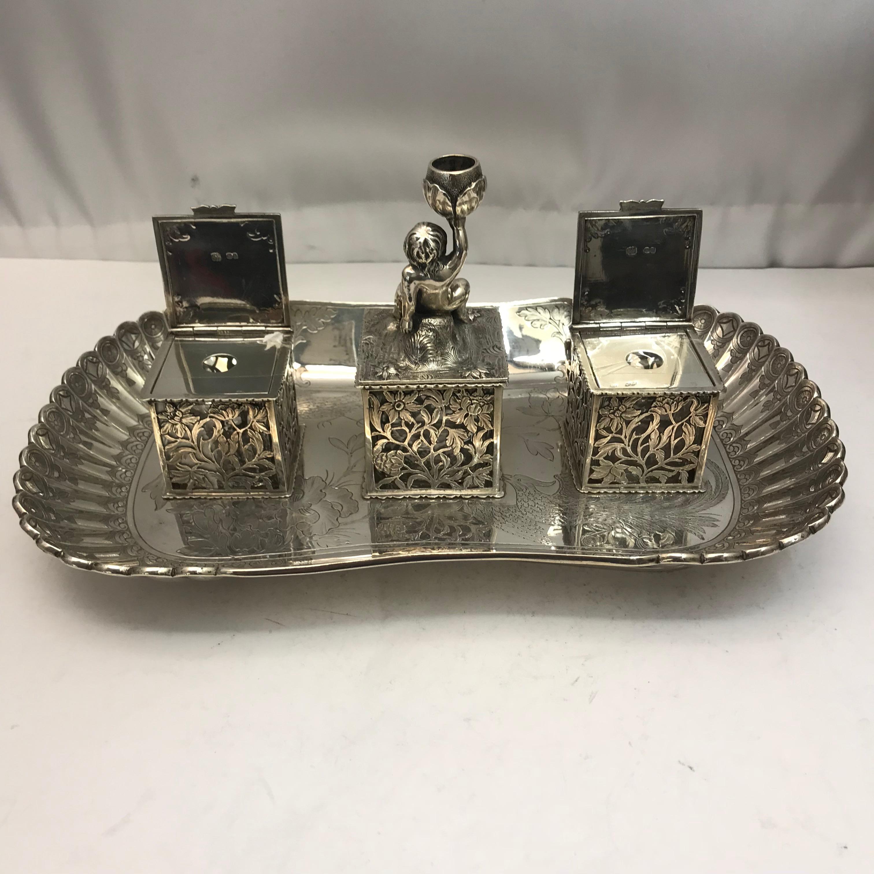 A 19th century antique silver inkwell with two lidded ink holders. Decorated beautifully. 

Made in London by G.G Fox

Measures: 5.50 inch high

11.50 inch wide.