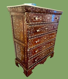A decorative Syrian inlaid five drawer commode with Carrera marble top