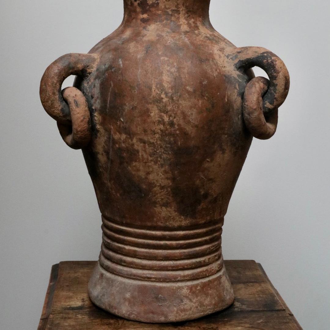 Juan Carlos is a decorative vessel with rich hues combined with an elegant patina featuring handles and ringlets.

Discovered in a potters studio in the region of Tlaquepaque, Mexico.

Juan Carlos
Mexico, 2000
Dimensions: 16