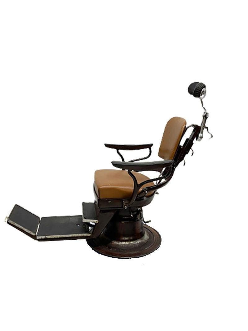 A dentist chair Type III, series 3266 by J. Corno, Union Frimor, France ca. 1920

The heavy chair has the color in a mahogany look with gold line. The chair has leather headrests and bakelite footrests. (loose defects) Foot pedals and adjustable