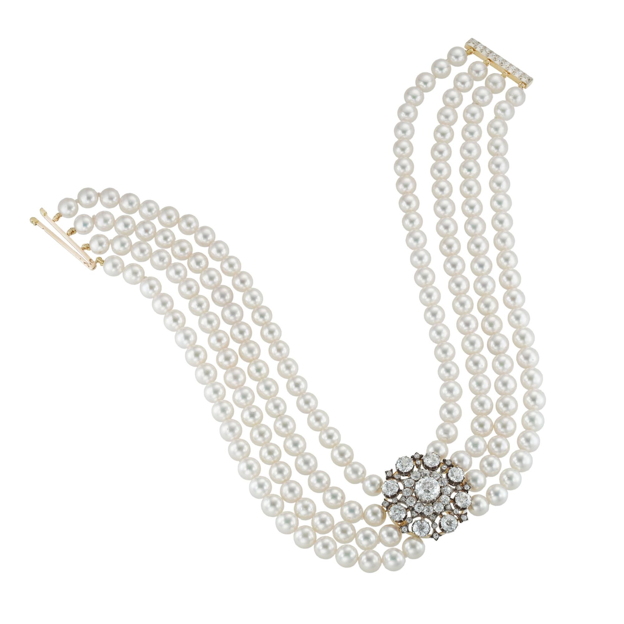 A diamond and cultured pearl necklace, the fine Victorian diamond centrepiece, centrally set with an old brilliant-cut diamond estimated to weigh 1.65 carats surrounded by old-cut diamond cluster surrounded by eight larger old brilliant-cut diamonds
