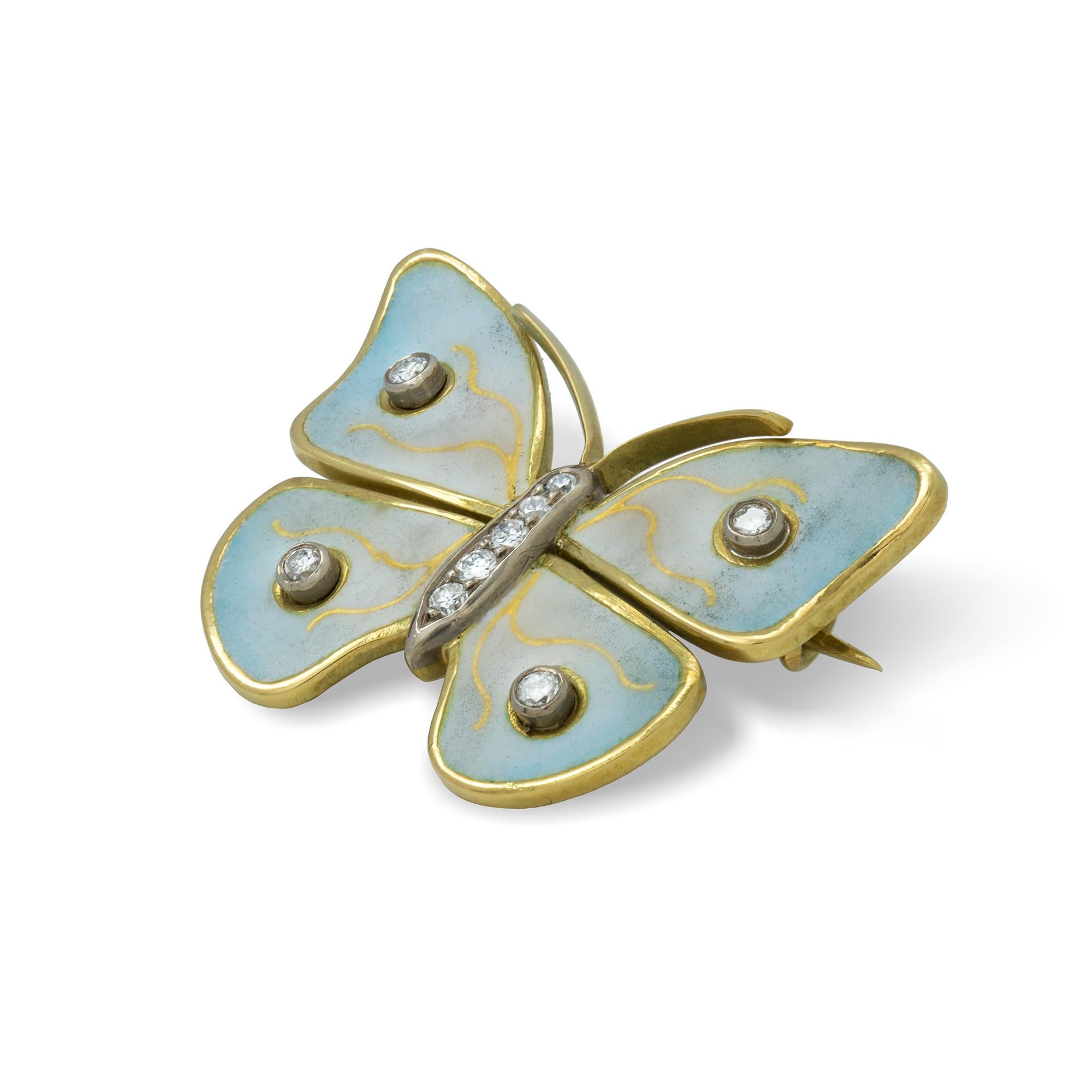 A diamond and enamel brooch in the form of a butterfly, the body set with diamond, the wings set with two diamonds each, with enamelled yellow fading to light blue, mounted in 18ct yellow gold bearing the Bentley & Skinner sponsor mark, measuring