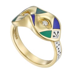 A diamond, enamel and gold mask ring