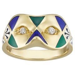 A diamond, enamel and gold mask ring