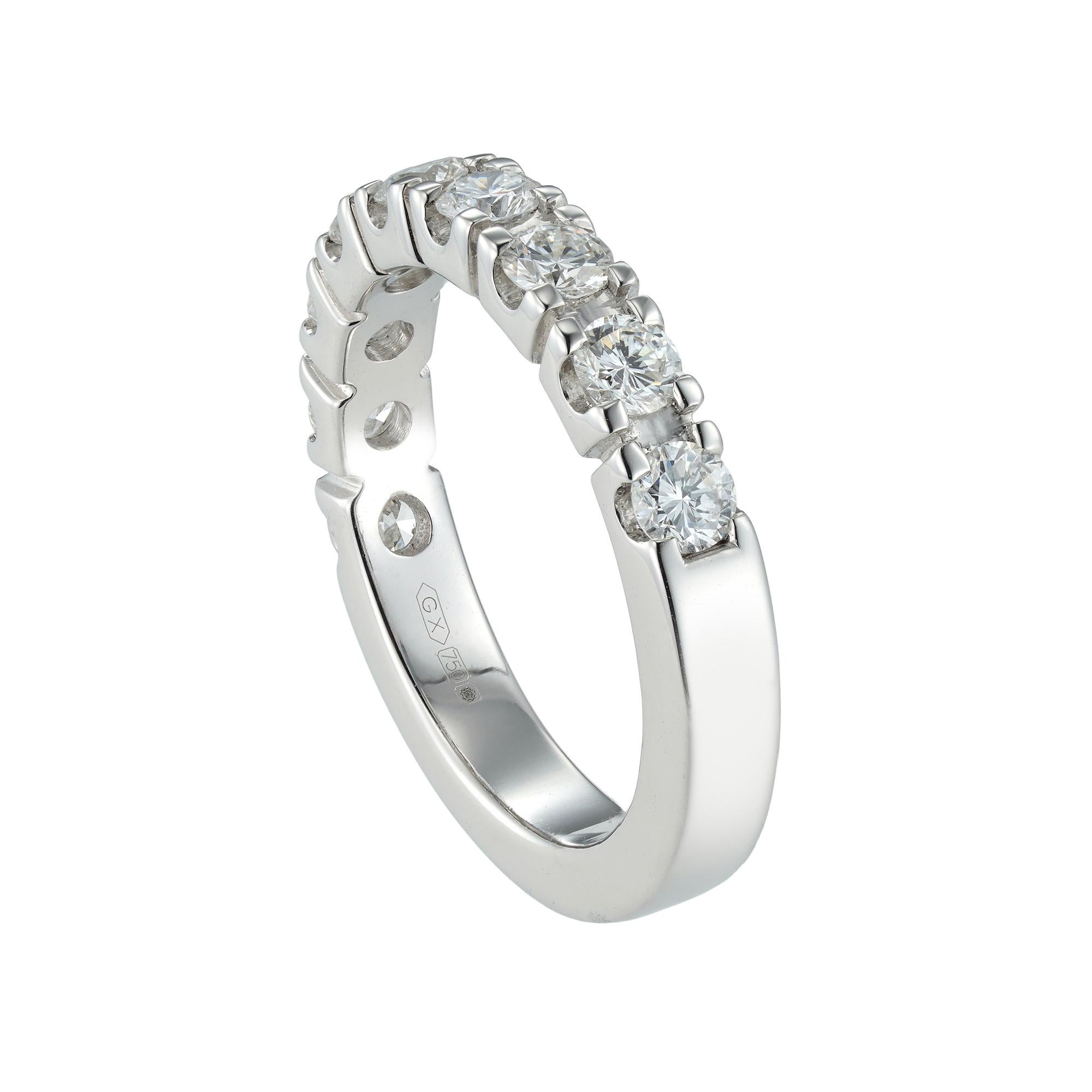 A diamond half eternity ring, the nine round brilliant-cut diamonds weighing 1.00 carat in total, all in a castle-set 18ct white gold mount, finger size M 1/2, gross weight 6.1 grams.

A sparkling diamond half eternity ring. This ring features a row