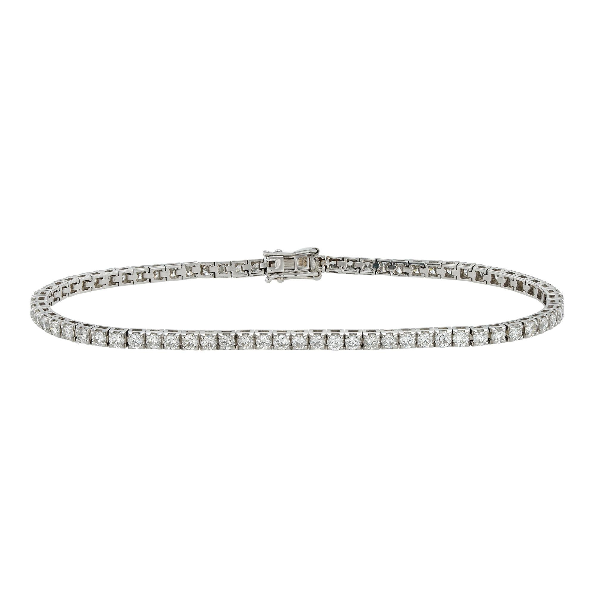 A diamond line bracelet set with 72 round brilliant-cut diamonds, weighing a total of 2.97 carats, all four claw-set to a white gold articulated mount with a concealed push clasp, hallmarked 18ct gold London 2016, bearing the Bentley & Skinner