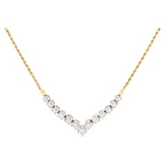 Un collar de diamantes de oro amarillo y oro blanco de 14 quilates