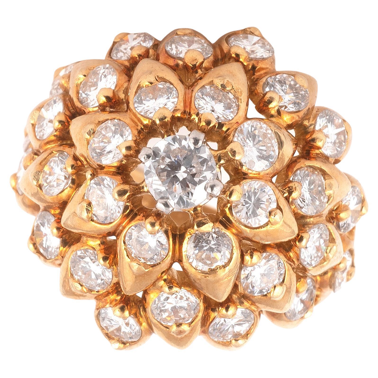 Of bombé design, set throughout with brilliant-cut diamonds within an 18 carat gold mount, maker's mark Kld, hallmarked London, diamonds approx. 3.05ct. total, ring size 7

The Kutchinsky business was established in 1893 when Hirsch Kutchinsky