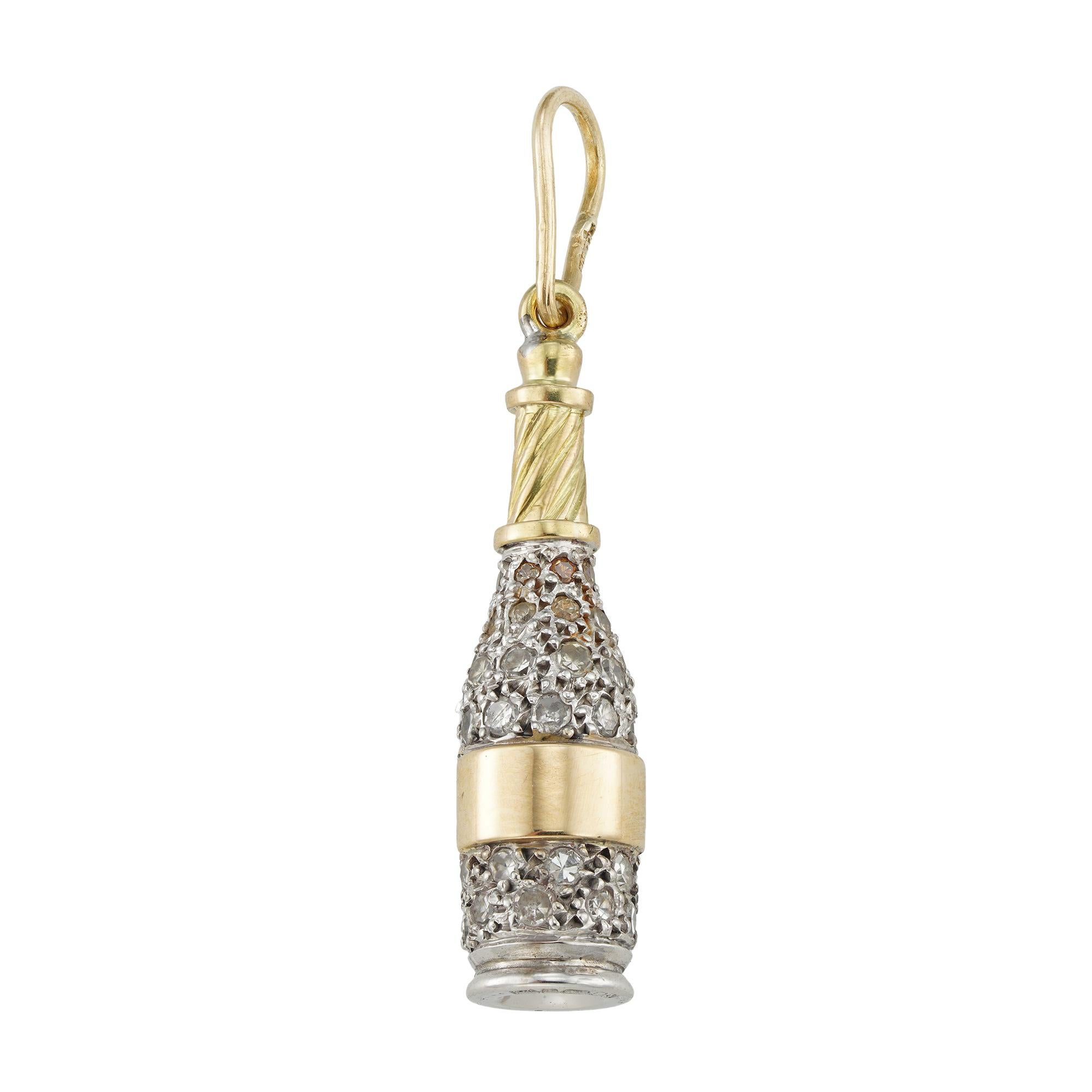 A diamond-set champagne bottle pendant, the realistically carved bottle set throught with small Swiss-cut diamonds estimated to weigh 0.4 carats in total, all mounted in white and yellow gold and suspended by gold pendant loop, circa 1950, later