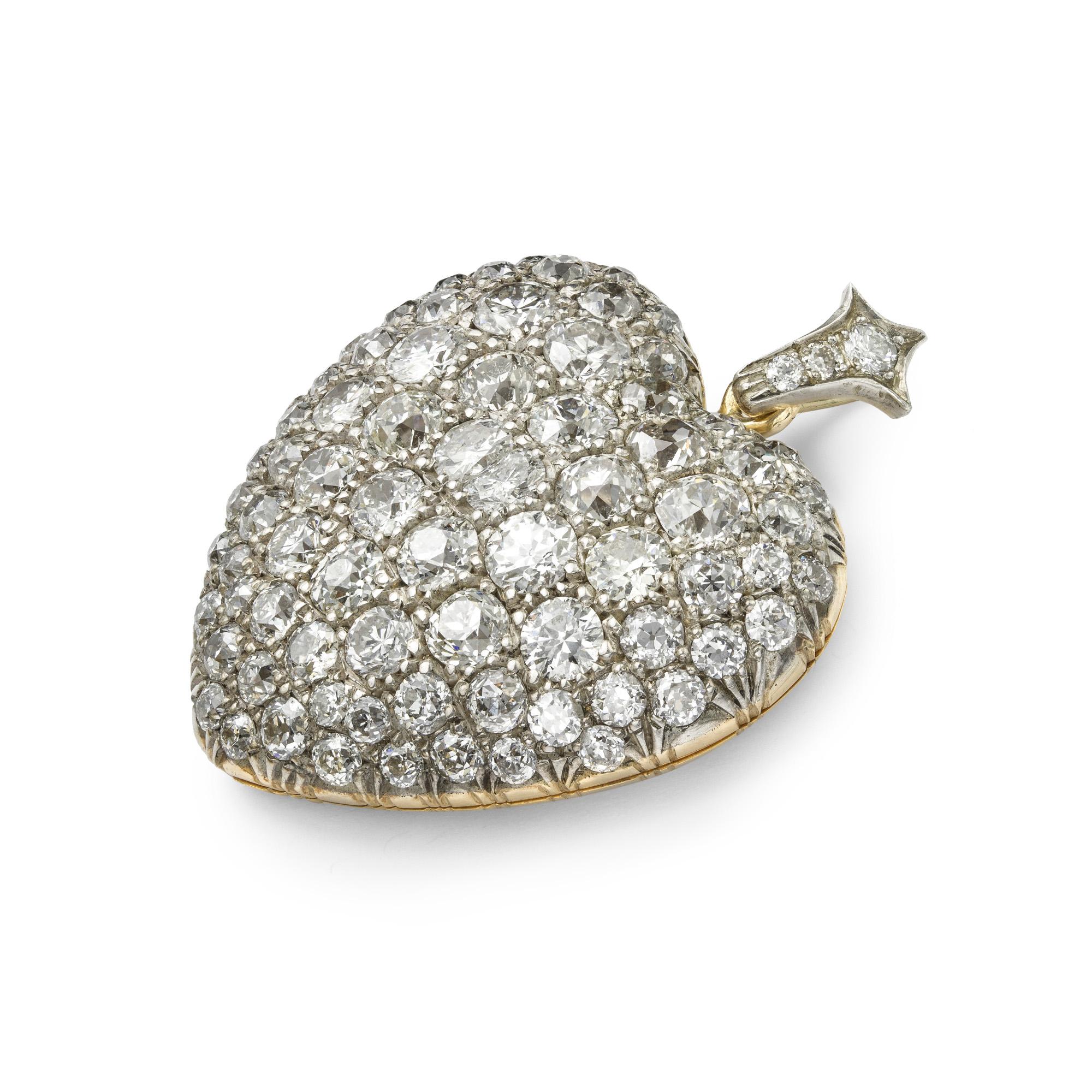 A Victorian diamond-set heart pendant, the pendant set throughout with old brilliant-cut diamonds graduating from the centre and estimated to weigh a total of 11 carats, grain set in silver to a gold mount with glass locket compartment to the