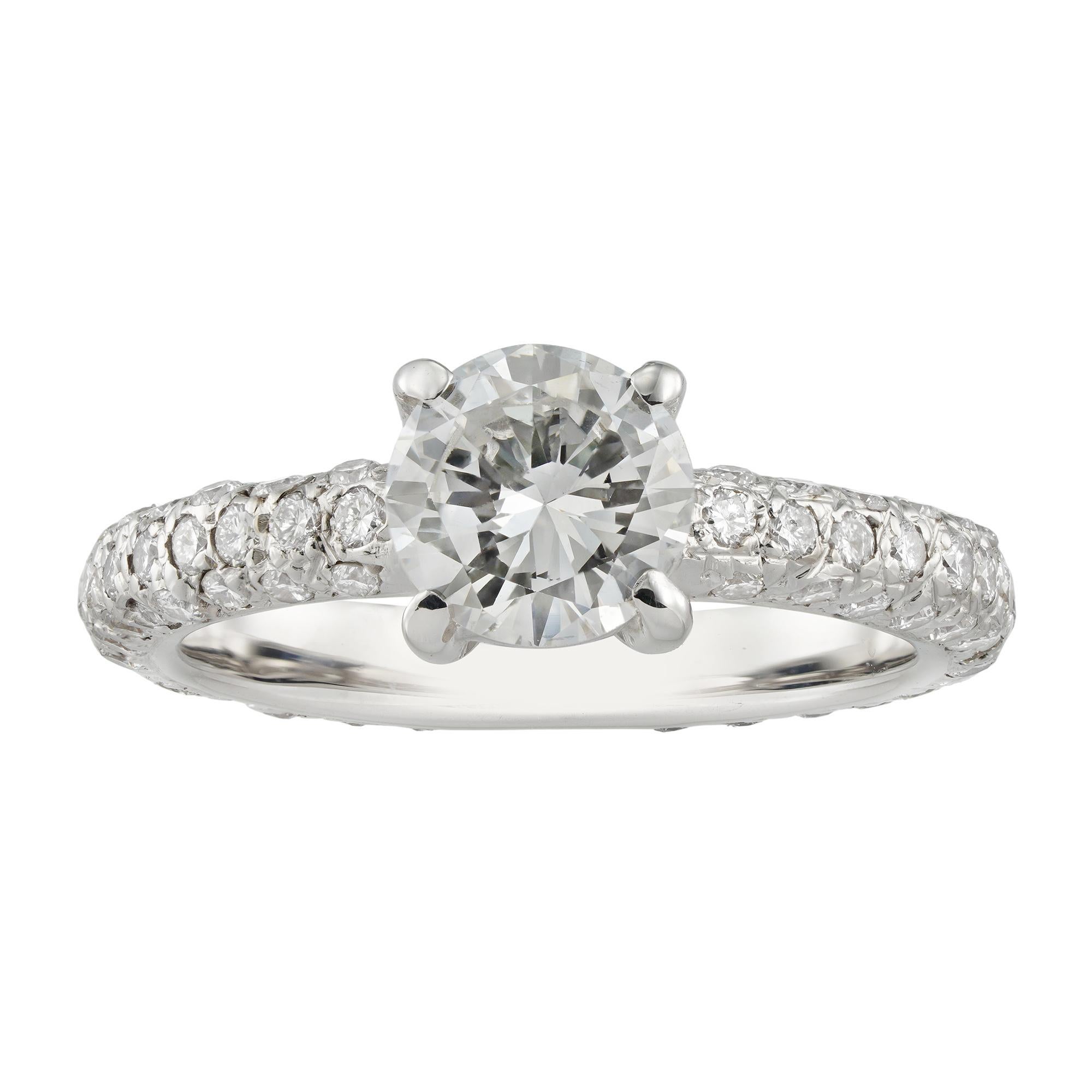 A diamond solitaire ring, the round brilliant-cut diamond weighing 0.80 carats assessed to be of G colour SI1 clarity, four claw set to a white gold mount with diamond set shank, the small diamonds estimated to weigh further total of 0.9 carats,