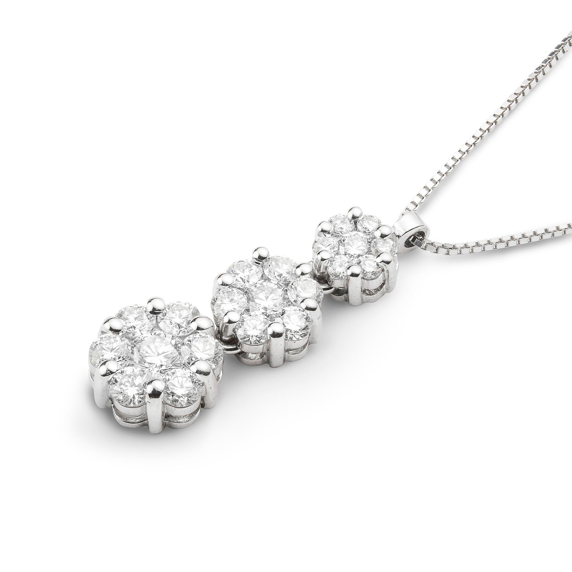 A diamond triple cluster pendant/necklace, consisting of the three graduating in  size round clusters, each set with seven round brilliant-cut diamonds, the diamonds estimated to weigh 0.7 carats in total, all claw-set in white gold mount, suspended
