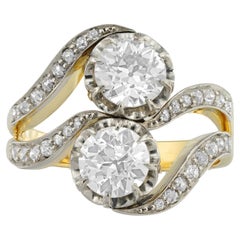 A diamond two stone cross over ring