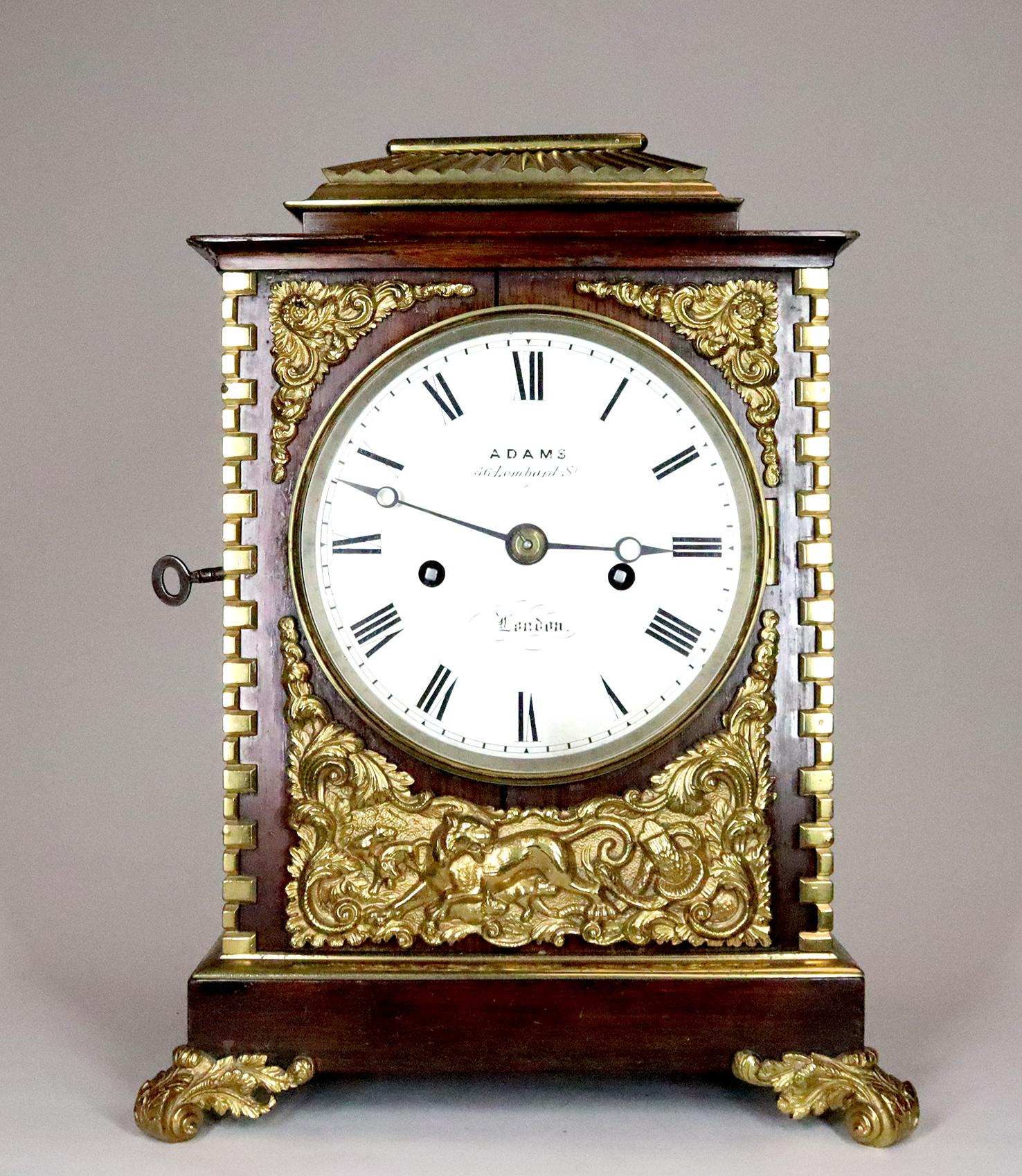 A rosewood and ormolu mounted bracket clock. With an eight day twin fusee movement, signed Adams of Lombard Street on the 5 inch silvered dial and movement back plate. Striking on a bell.

The case of this bracket clock has a delightful pergoda