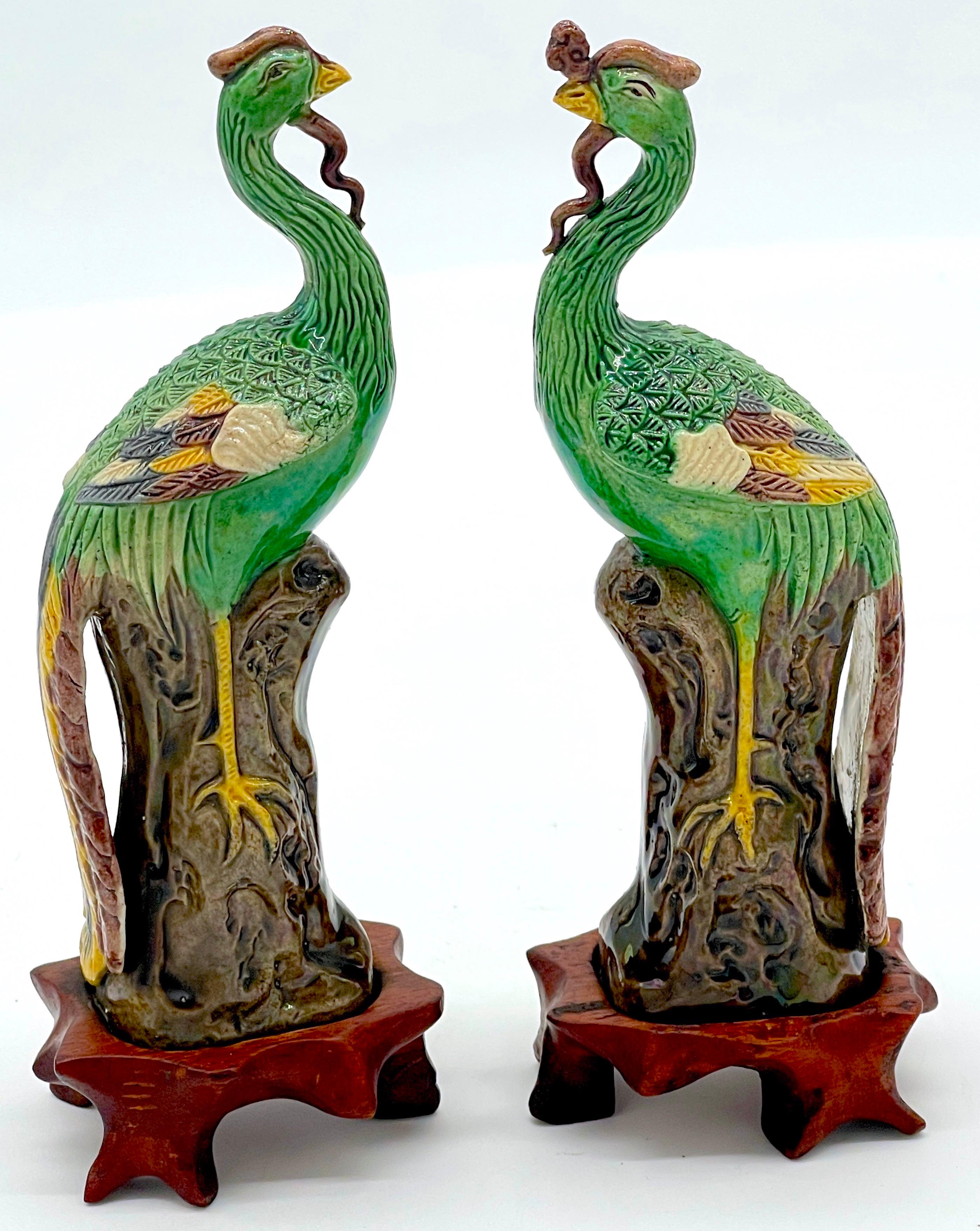Chinese Export A Diminutive Pair of Chinese Sancai Glazed Phoenix Birds, on Hardwood Stands  For Sale