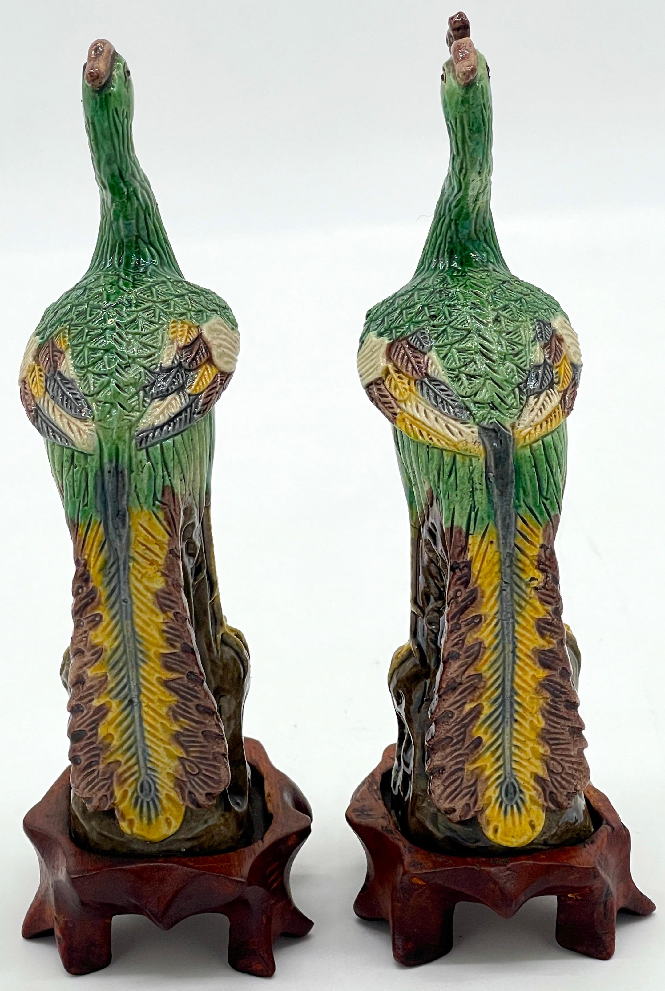 A Diminutive Pair of Chinese Sancai Glazed Phoenix Birds, on Hardwood Stands  In Good Condition For Sale In West Palm Beach, FL