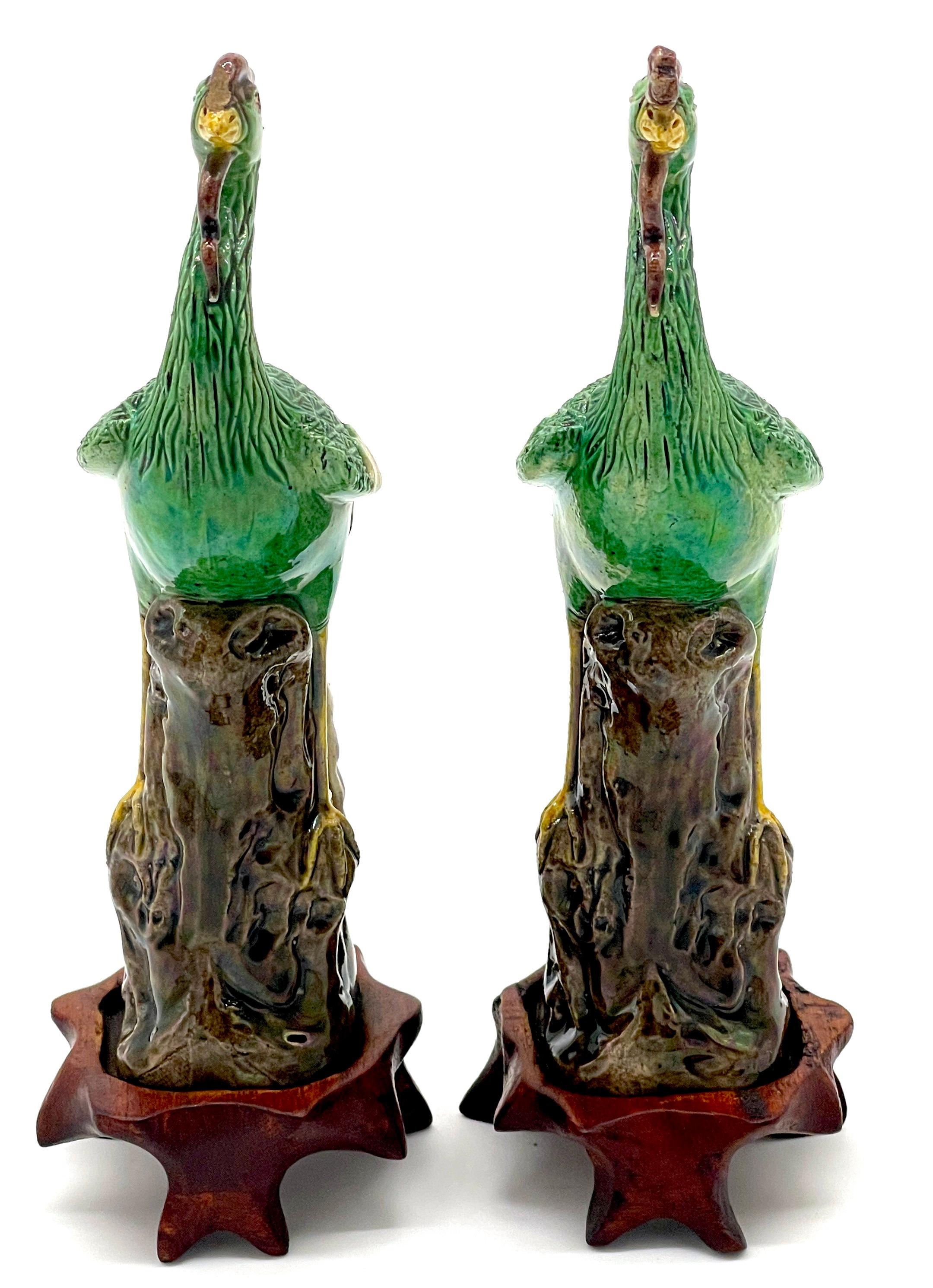 Porcelain A Diminutive Pair of Chinese Sancai Glazed Phoenix Birds, on Hardwood Stands  For Sale
