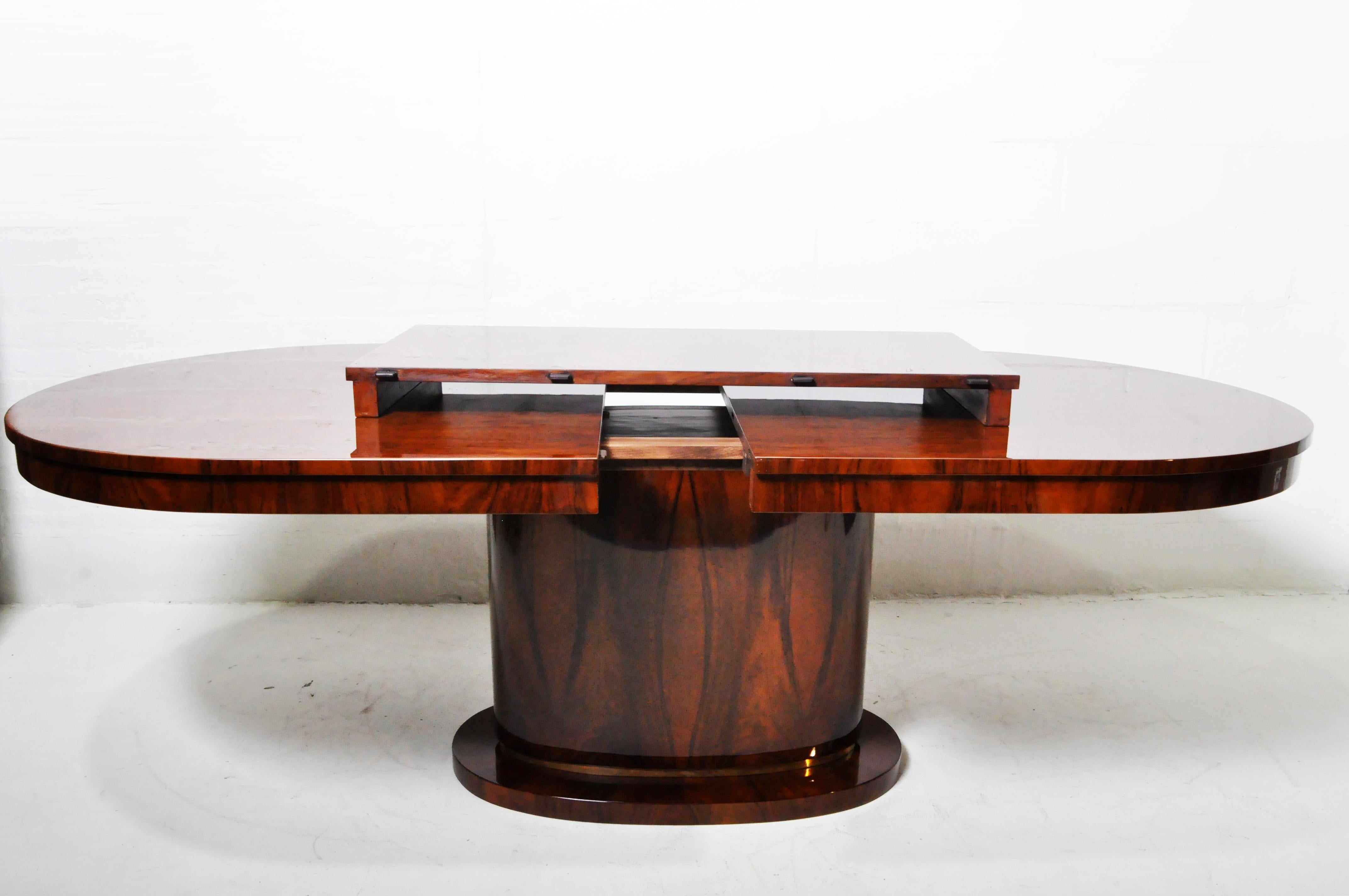 Dining Table with Walnut Veneer and a Brass Foot 1