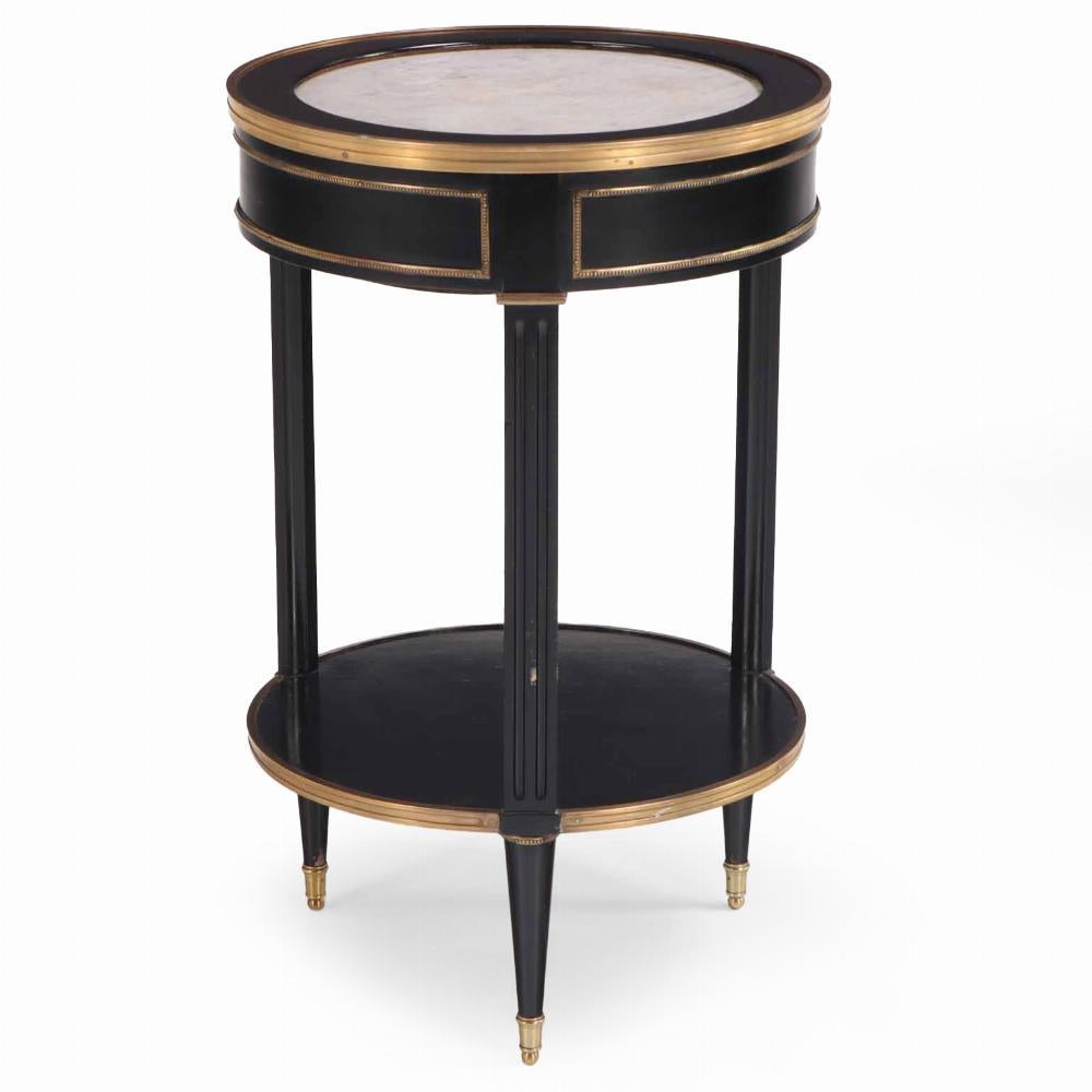 Argentine A Directoire style ebonized and bronze mounted marble top table, C. 1940. For Sale