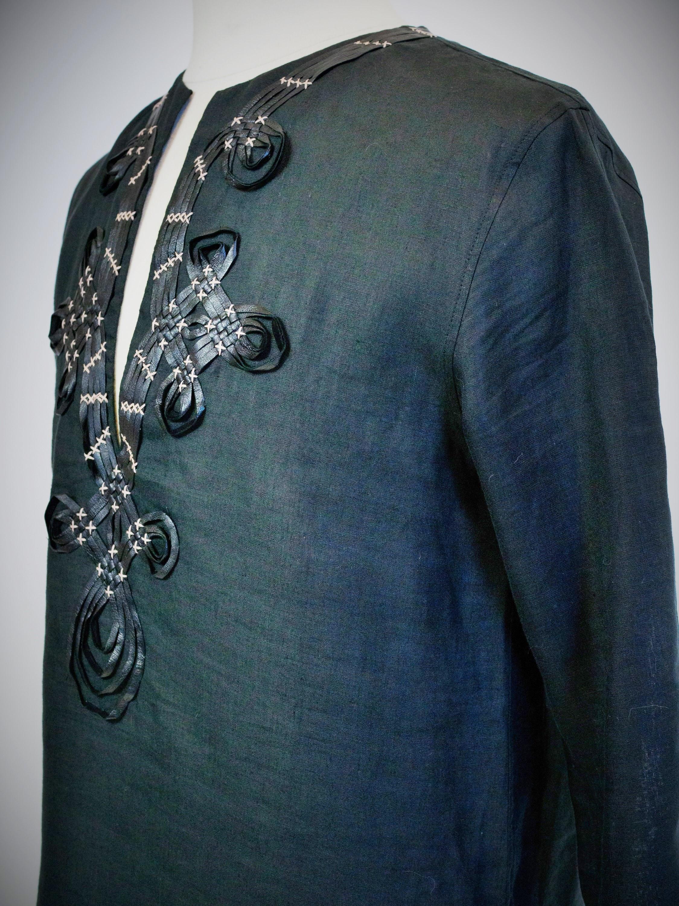 Women's or Men's A Djellaba blouse by Jean-Paul Gaultier in embroidered black linen Circa 2000 For Sale