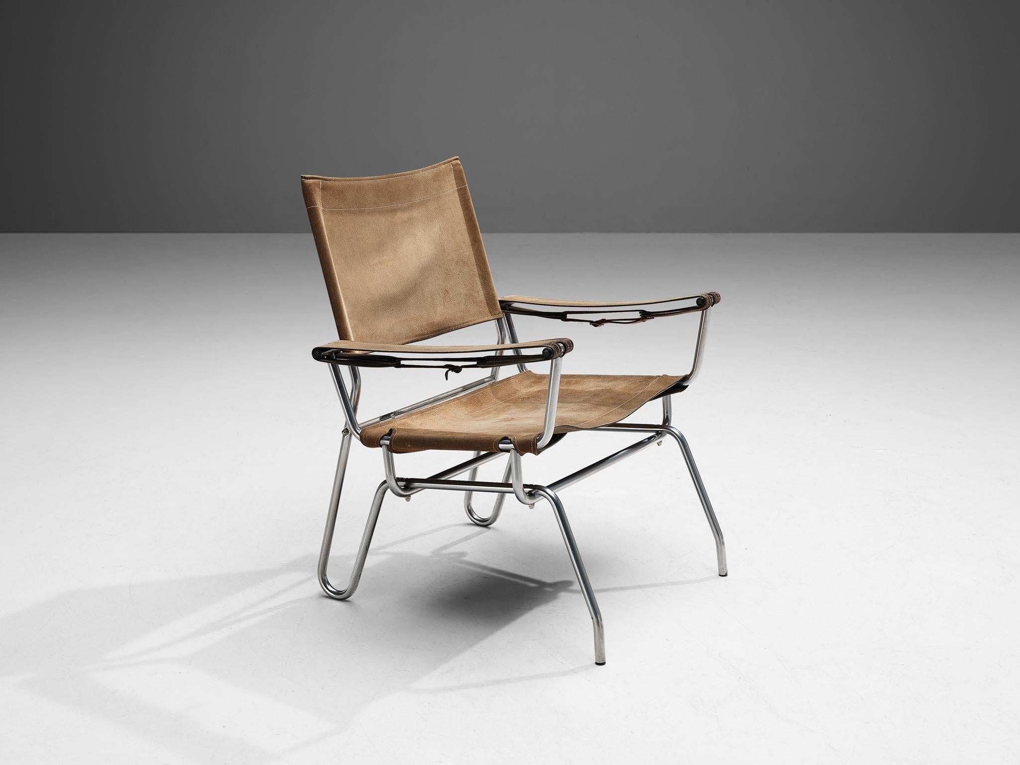 A. Dolleman for Metz & Co, armchair, suede, brass, metal, The Netherlands, 1960 

This rare modernist lounge chair embodies a unique, appealing design. The tubular metal frame is sleek and is beautifully bent into shape. The seat and backseat are