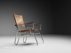 A. A. Dolleman per Metz & Co. Poltrona in pelle scamosciata con struttura tubolare in metallo