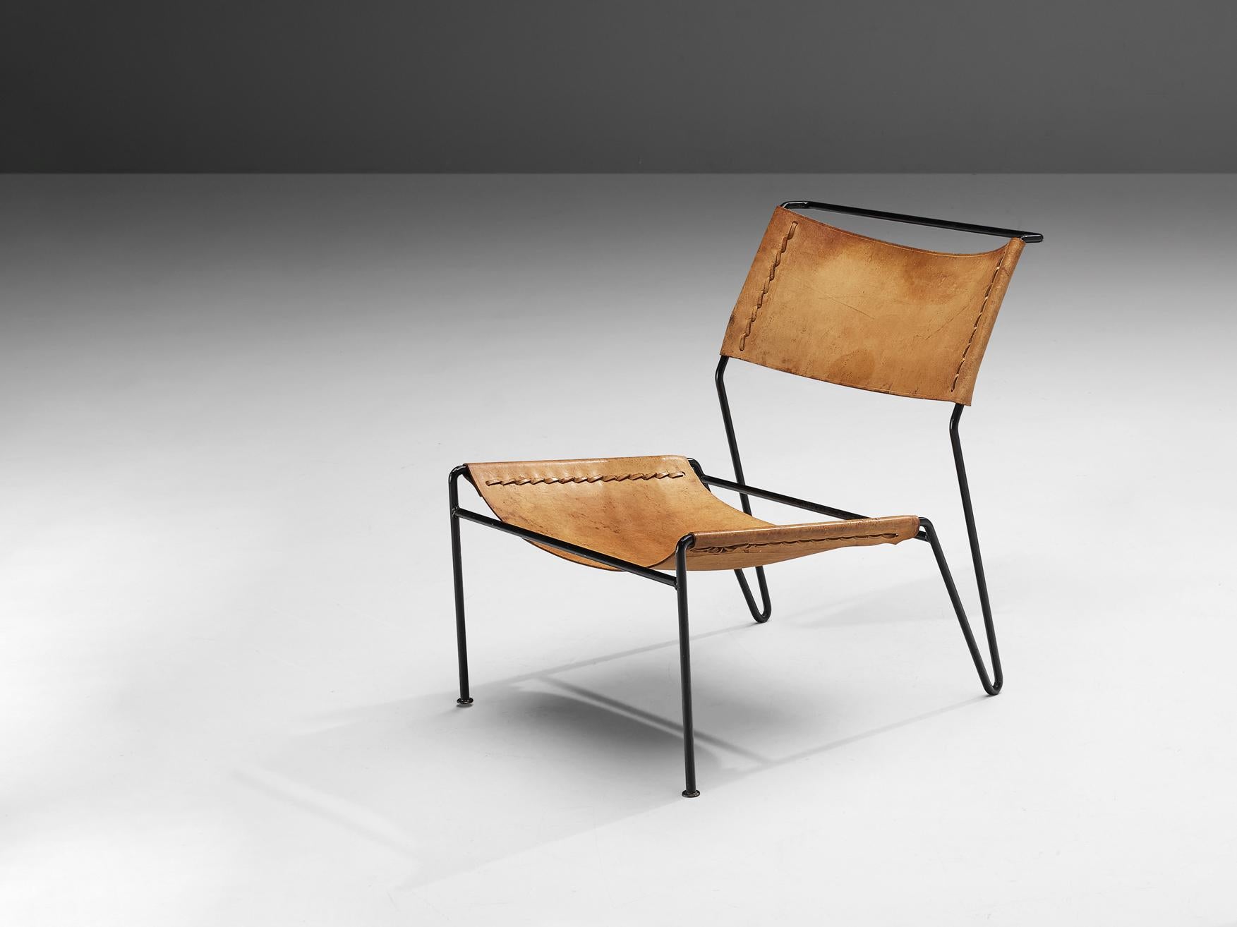 A. Dolleman for Metz & Co, easy chair, saddle leather, tubular metal, The Netherlands, 1950s

Modernist easy chair designed by the Dutch designer A. Dolleman for Metz & Co. The chairs show an appealing  and surprising design. The tubular metal frame