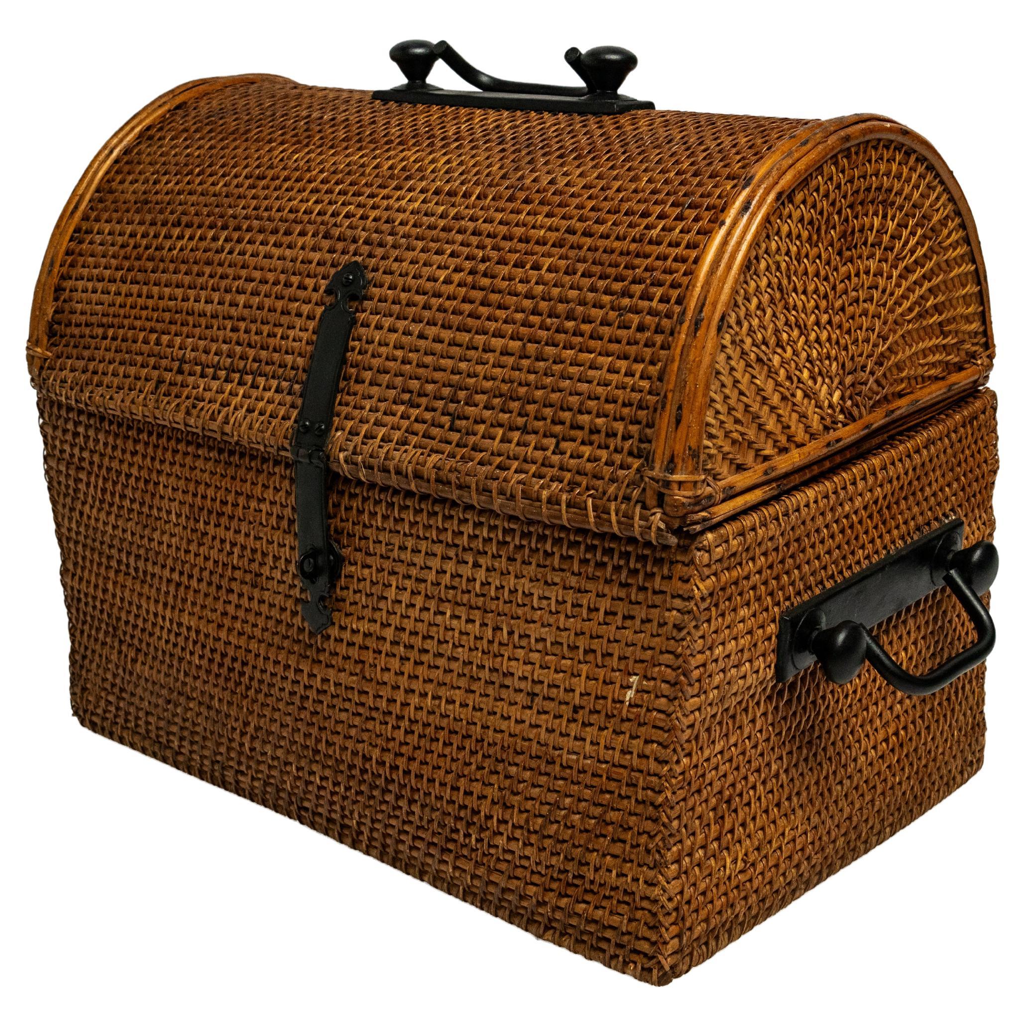 A Domed Rattan Woven Basket with Iron Hardware