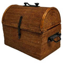 A Domed Rattan Woven Basket with Iron Hardware