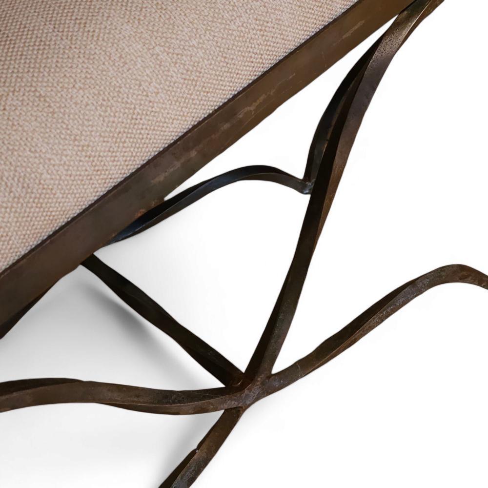 Striking a balance between classical form and modern elegance, this sculptural double curule bench channels the grandeur of ancient design with refined restraint. The wrought iron base features a double-X silhouette—bold yet airy—evoking