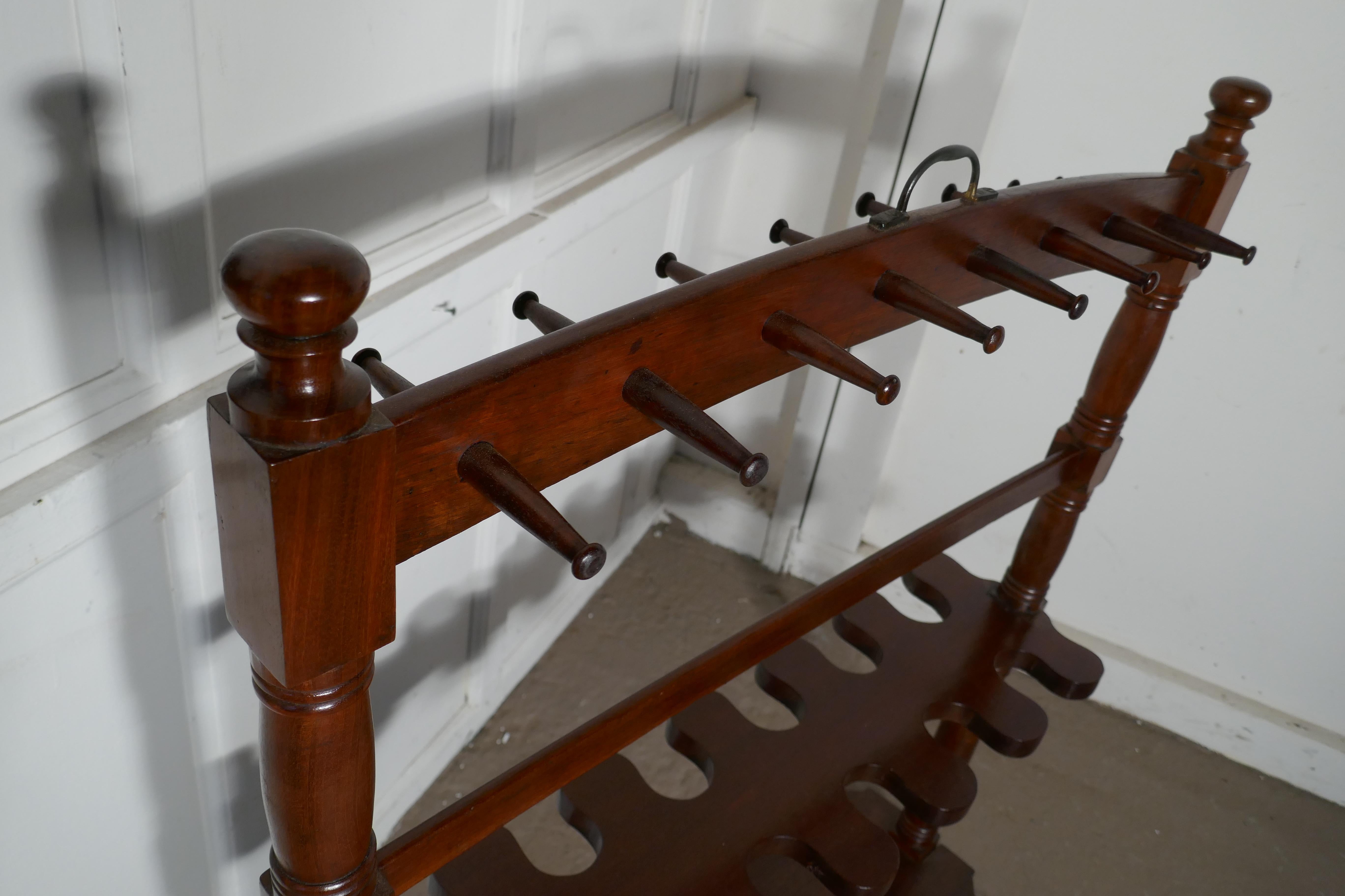 A double sided Georgian mahogany boot and whip rack. 

A double sided Georgian mahogany boot and whip rack this great piece is in very good condition. This antique mahogany boot rack dates from circa 1800. Complete with turned decorative finials