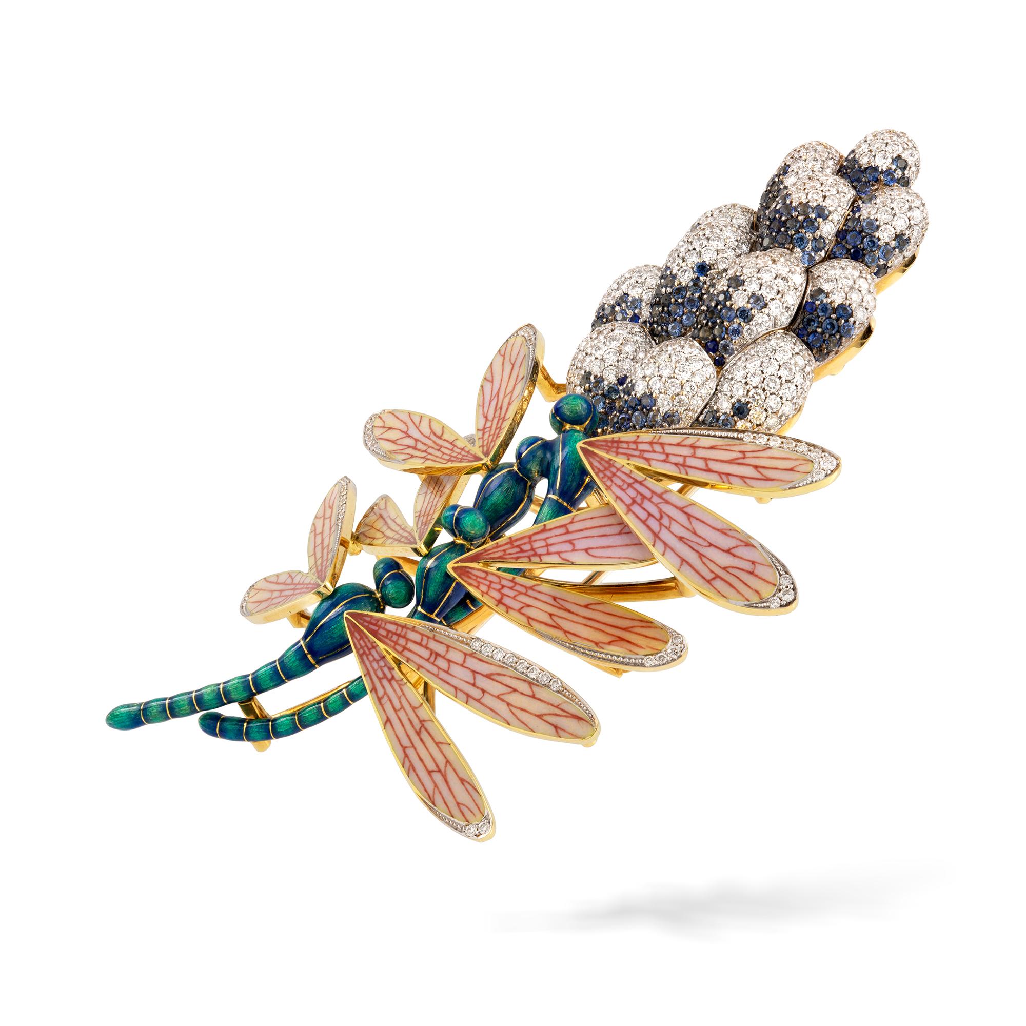 A dragonfly and hyacinth brooch, the three realistically carved dragonflies with hot-enamelled bodies and champlevé enamelled wings with diamond-set details, resting on a hyacinth encrusted with diamonds and blue sapphires, the diamonds weighing 3