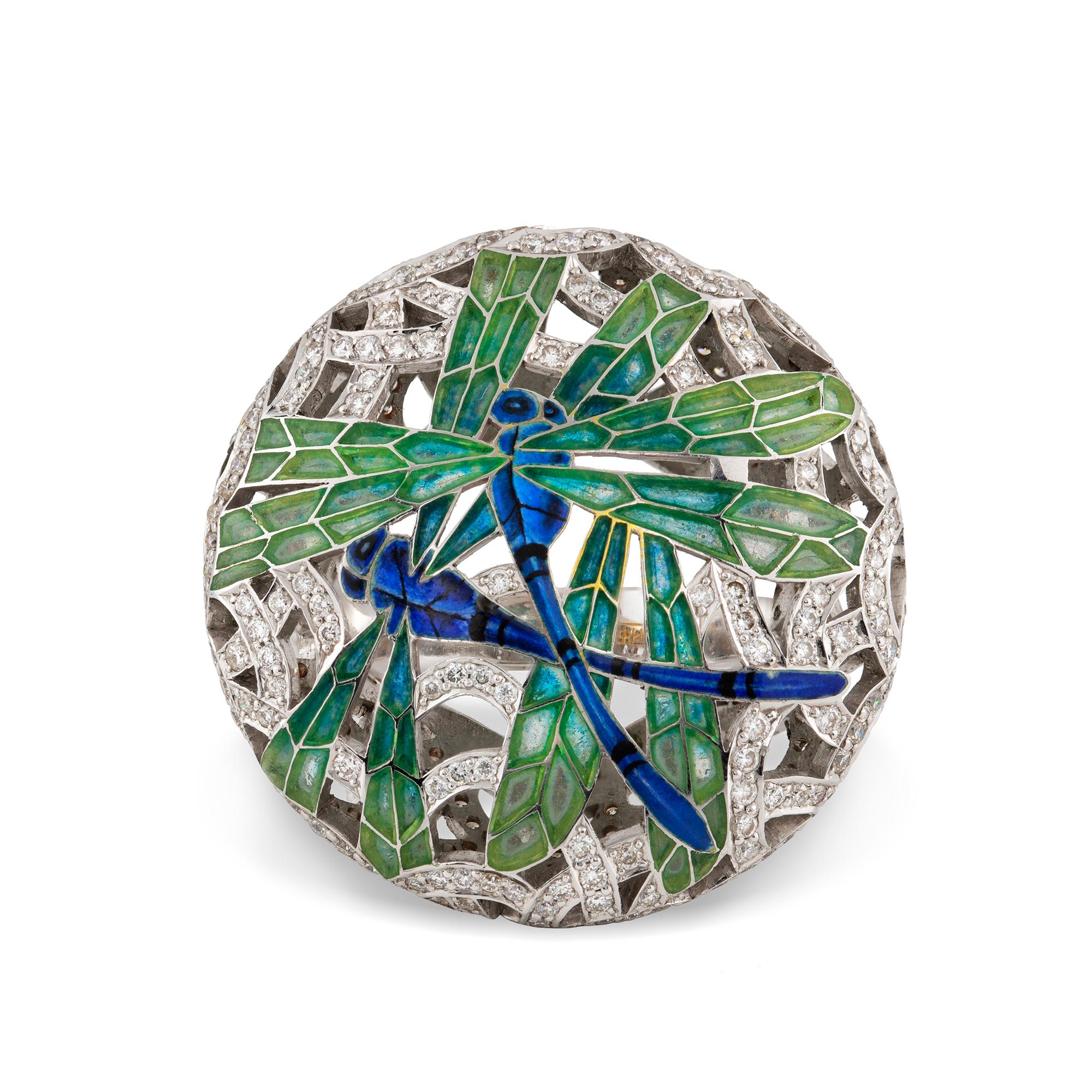 A Dragonfly enamel and diamond ring by Ilgiz F, the two dragonflies with feu- enamelled bodies and fine plique-á-jour wings, on an openwork round brilliant-cut diamond-set background of round shape, to openwork diamond-set shoulders and tapering
