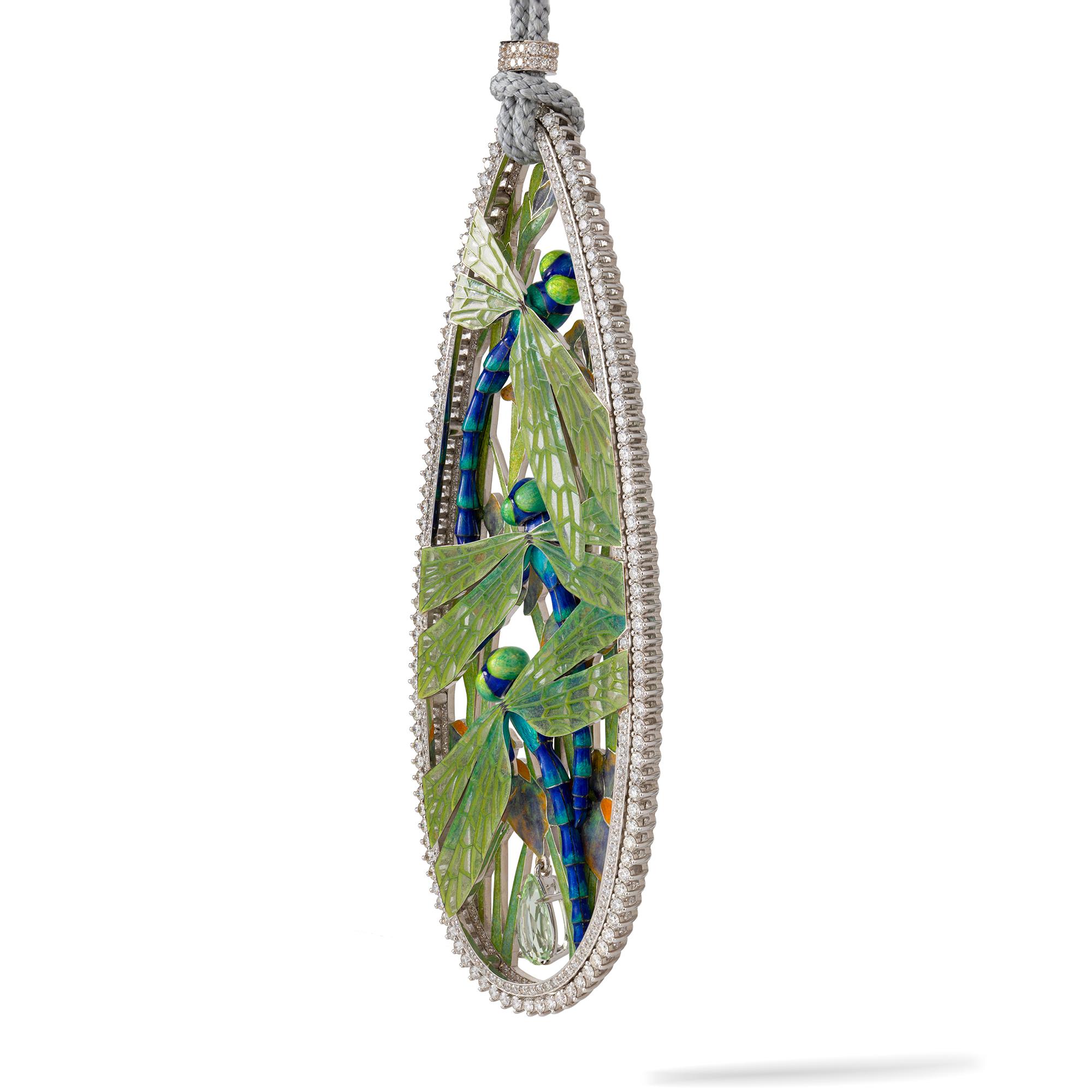 A Dragonfly pendant by Ilgiz F, the drop shaped openwork pendant depicting three realistically carved dragonflies, with feu-enamelled bodies and fine plique-á-jour wings, suspending a pear-shaped green beryl and surrounded by a diamond-set frame,