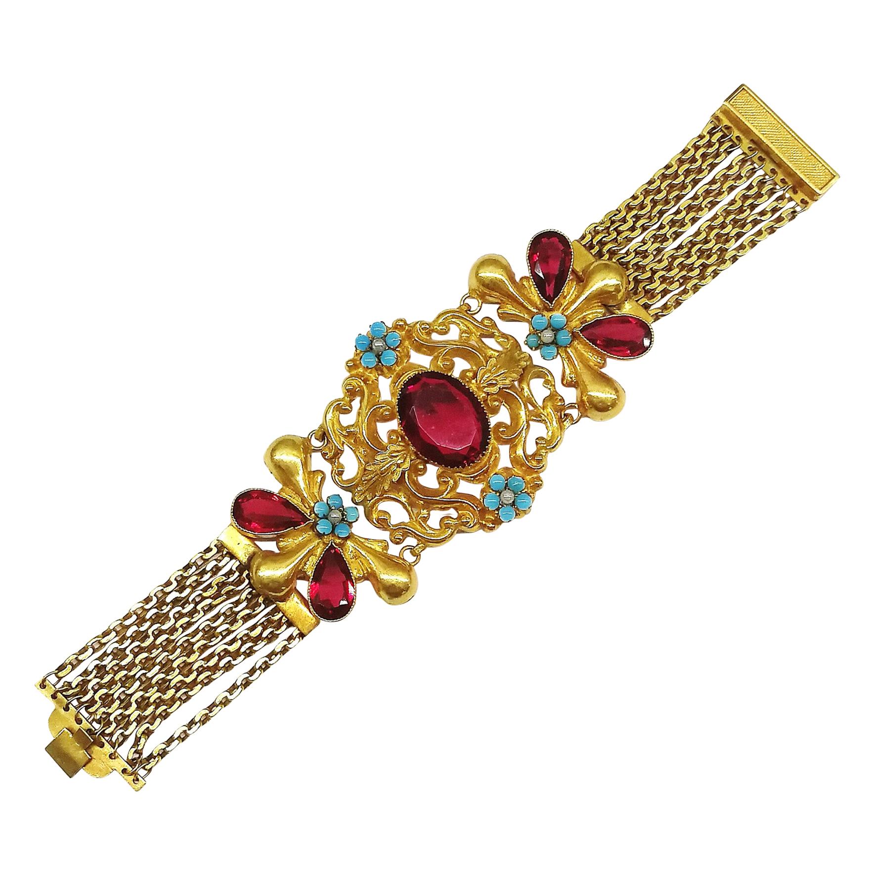 A dramatic wide gilt metal and paste bracelet, in a fitted box, c1900s