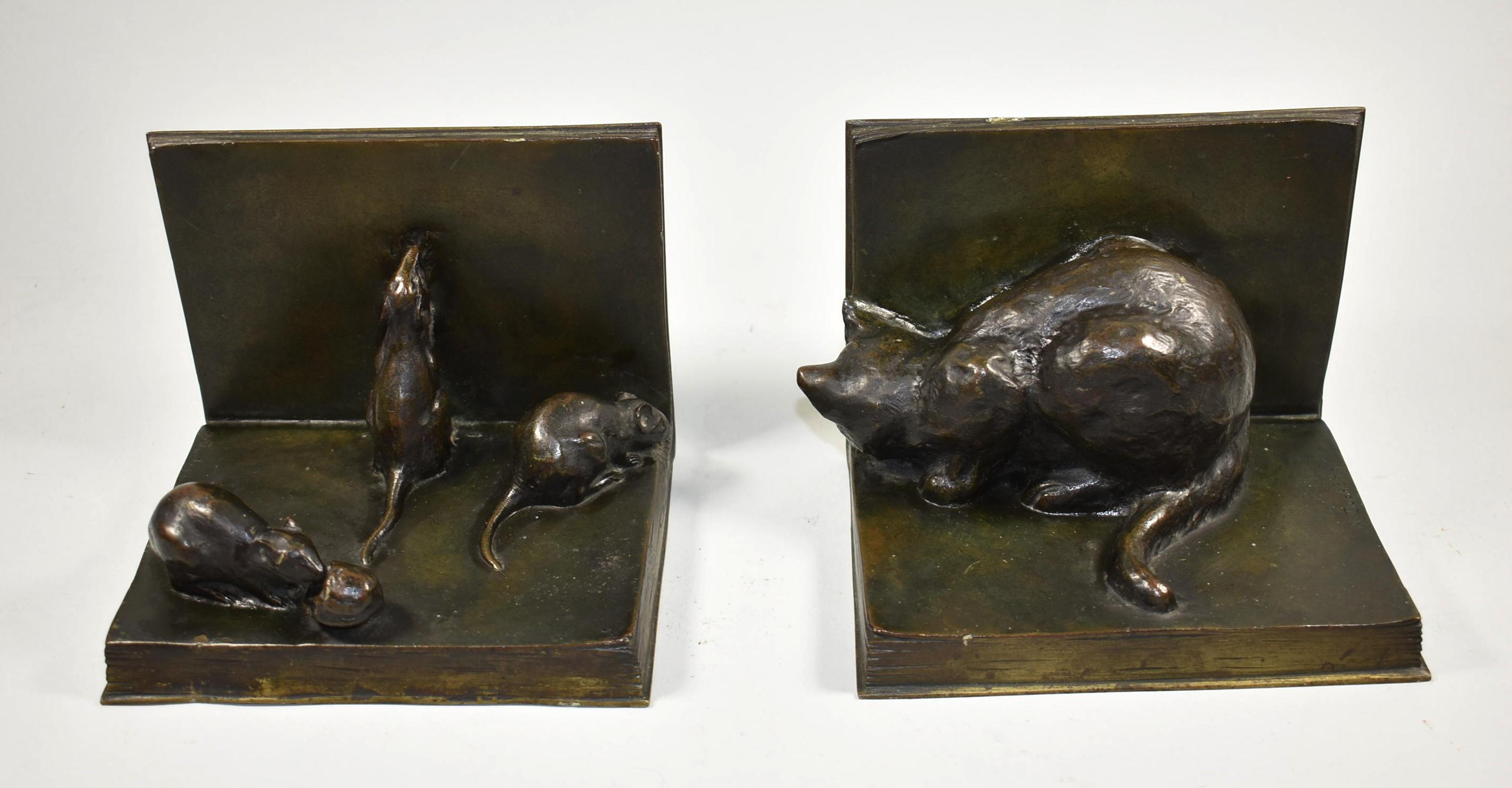 Patinated bronze stalking cat and mice bookends. One mouse eating a nut.