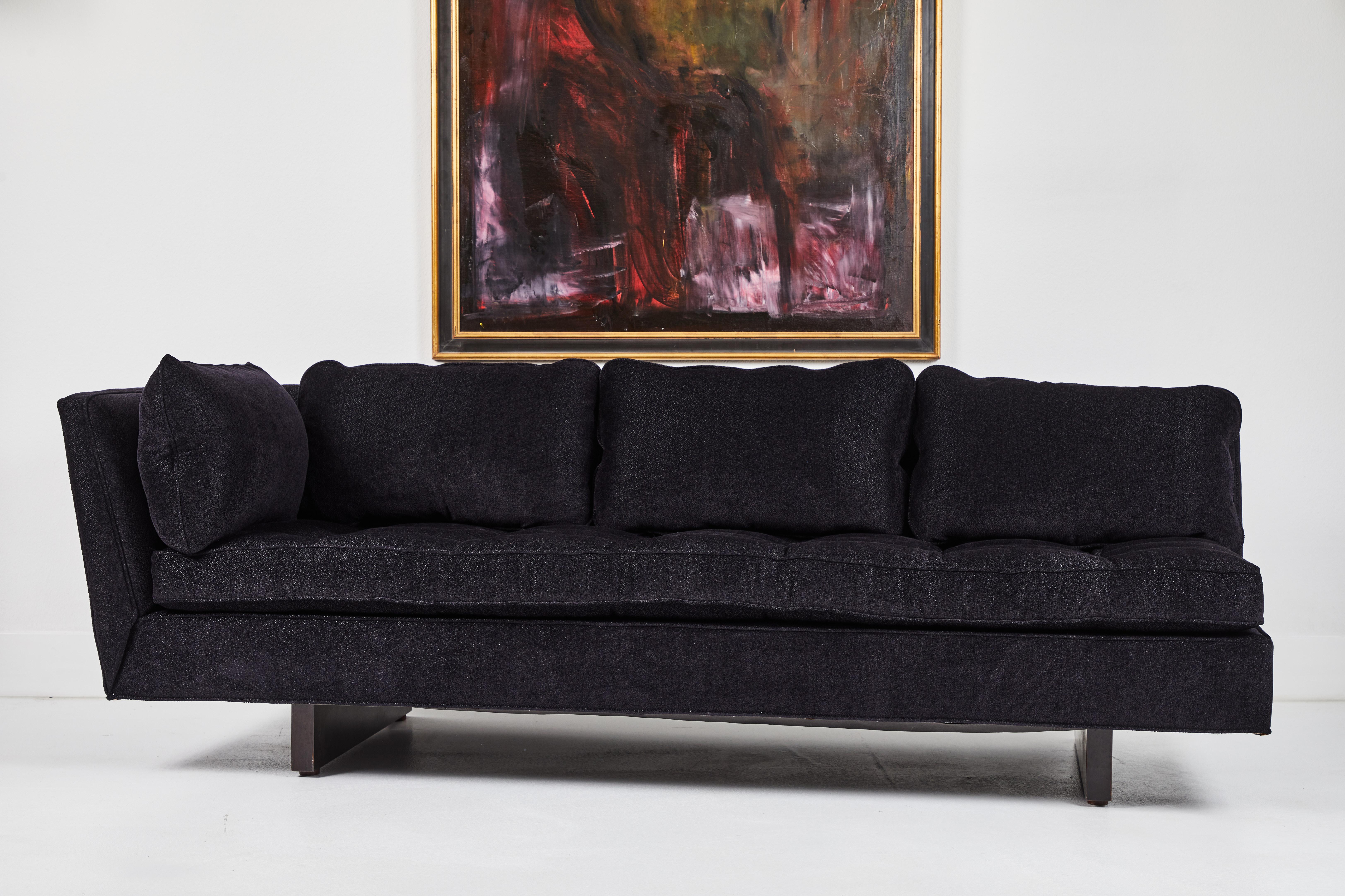 This is a wonderful example of a period sofa by Edward Wormley for Dunbar Furniture. Circa 1960s, it is a single left arm sofa and sits on two wood runner legs that continue up the back of the sofa and are secured with brass screws. It has been