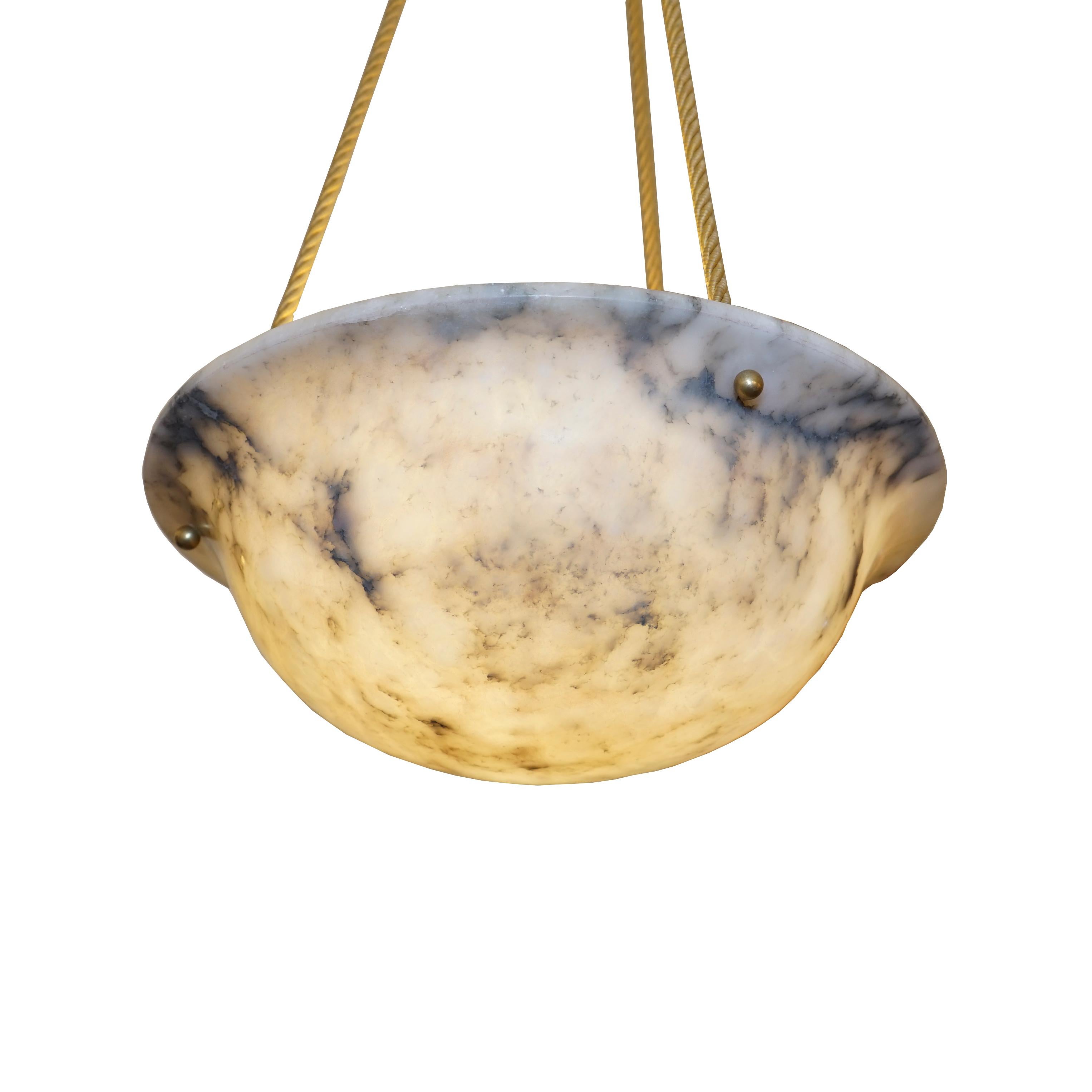 A classical bowl shape, this beautiful alabaster features sandy as well as charcoal colored hues. The canopy is carved from a matching stone. Recently rewired, the light holds three sockets which corresponds to three 100 watt equivalent LED bulbs or