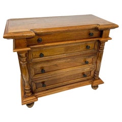 A Dutch 19th Century miniature wooden chest of drawers 