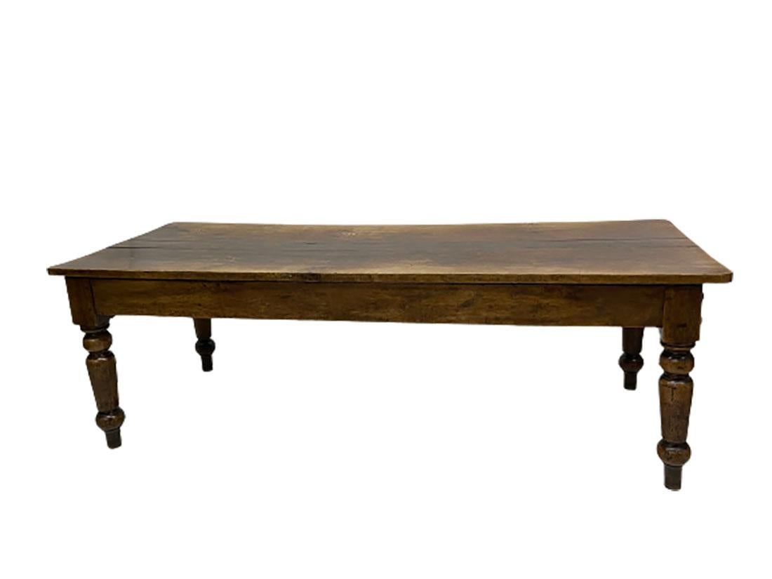 A Dutch 19th century oak country style dining table.

A Dutch 19th century oak country style dining table with turned wooden farmers legs. The very large antique table has a beautiful patina and on one side is a blind side and on the other side are