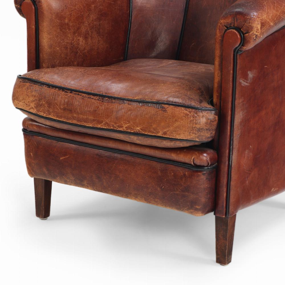 A Dutch Art Deco leather club chair, C 1940. In Fair Condition For Sale In Philadelphia, PA